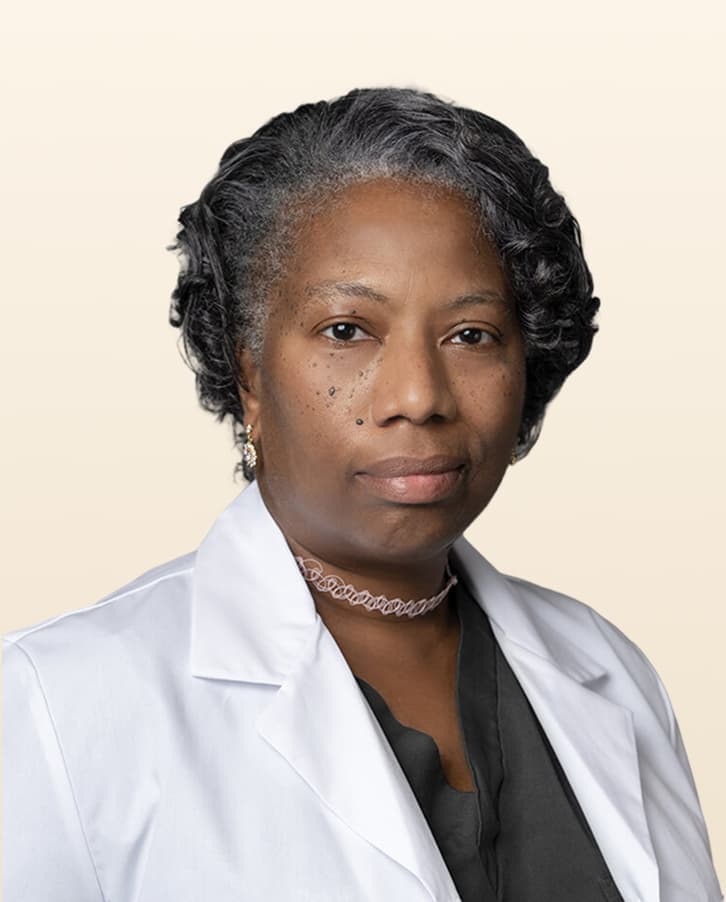 A professional portrait of  Jesslyn Perry, MD