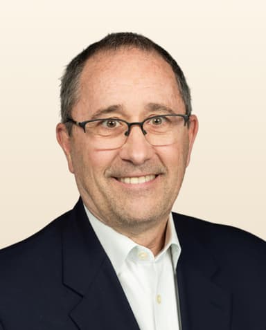 A professional portrait of Steve Swift